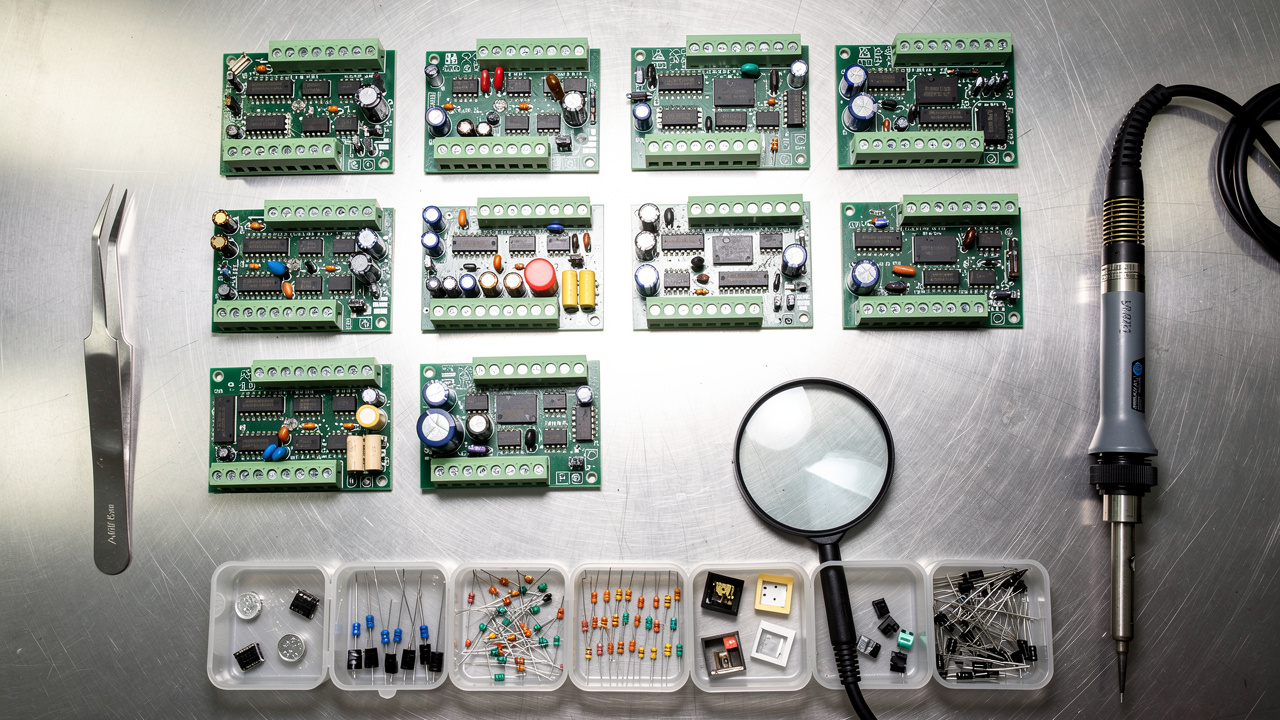 Industrial control board components laid out for repair and refurbishment